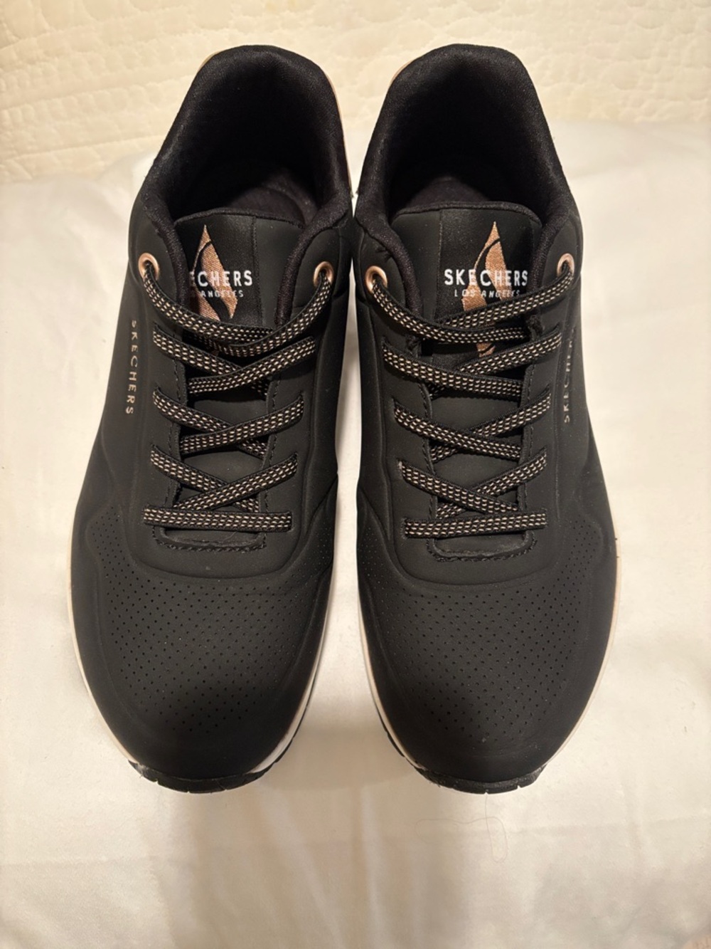 Skechers women’s Black Athletic Slip On Sneakers with Rose Gold Accents